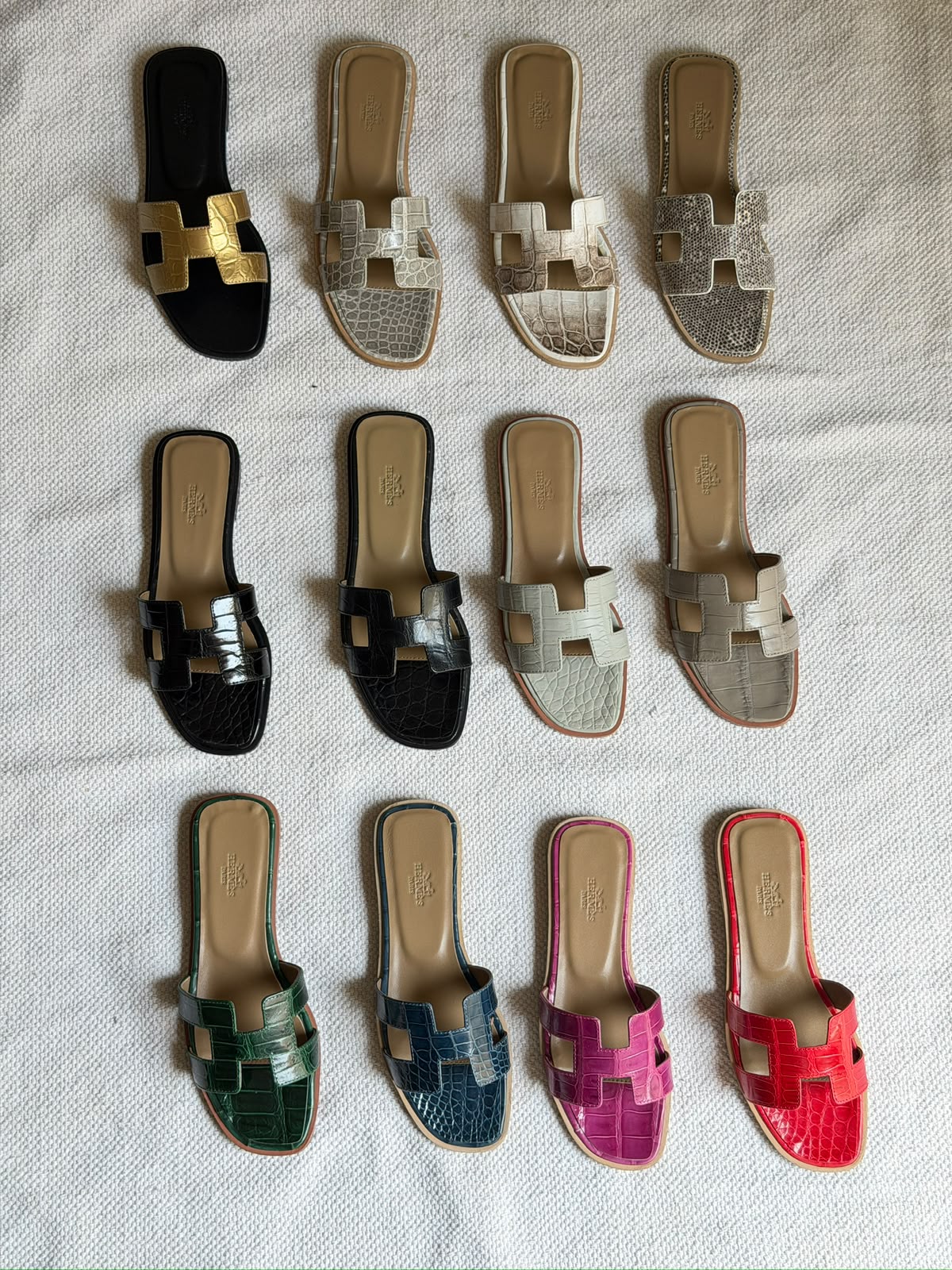 Hermès Oran sandals in crocodile-embossed leather