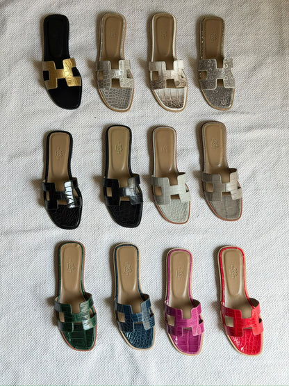 Hermès Oran sandals in crocodile-embossed leather