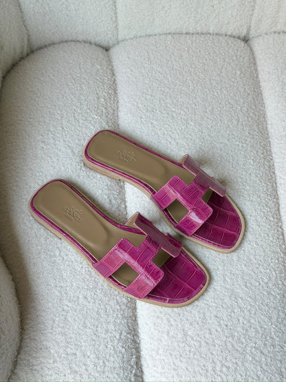 Hermès Oran sandals in crocodile-embossed leather
