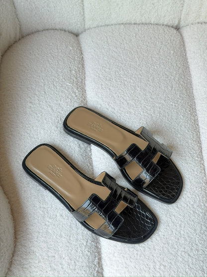 Hermès Oran sandals in crocodile-embossed leather