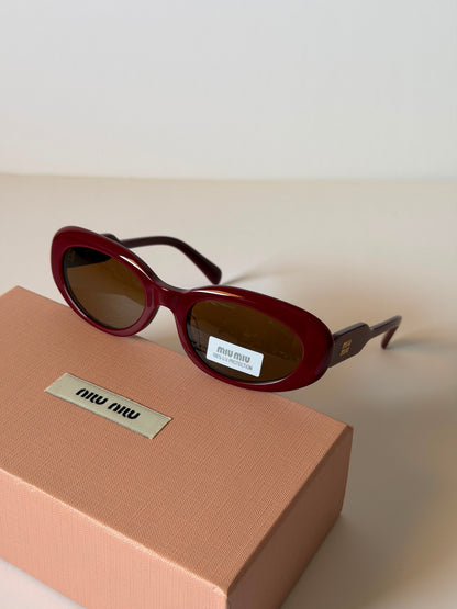 MIU MIU oval sunglasses