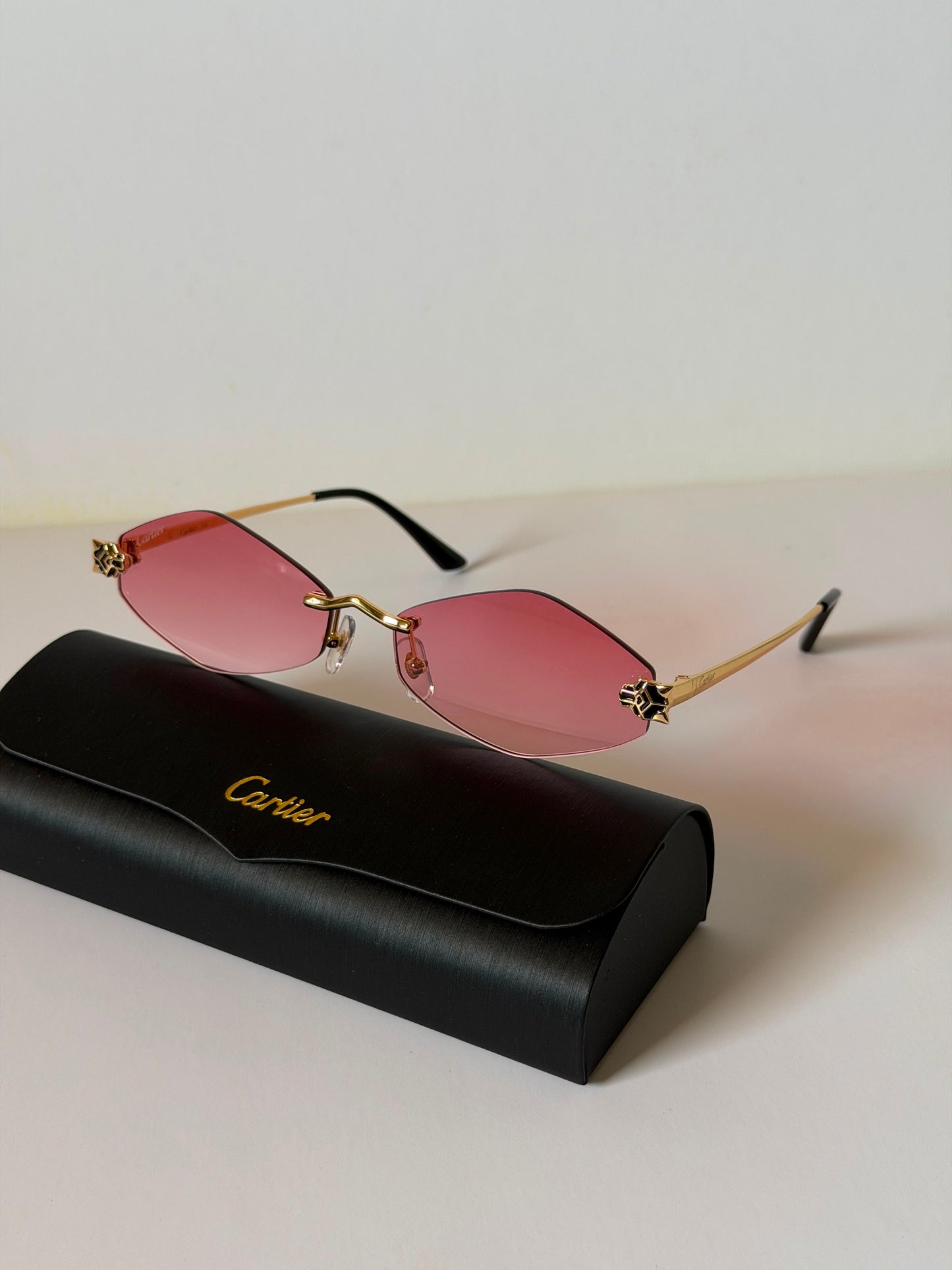sunglasses are the Cartier Panthère de Cartier Rimless Model CT0433S