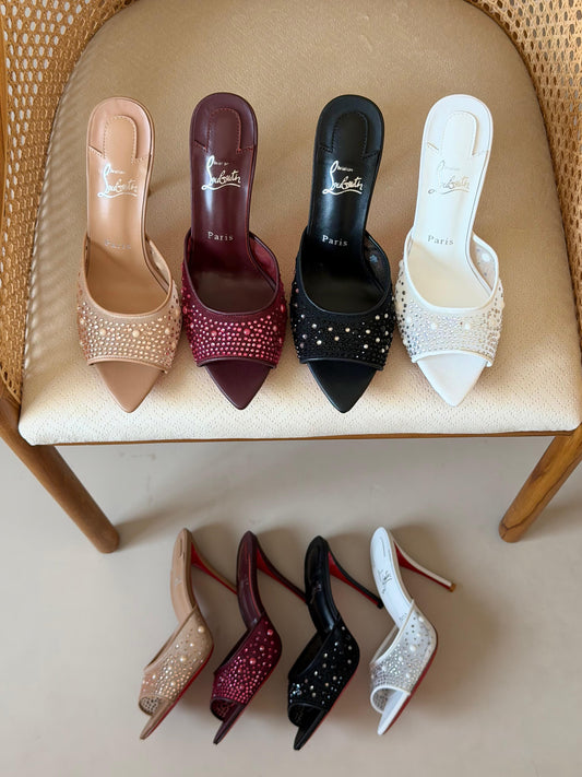 Christian Louboutin "Miss Z" mules feature