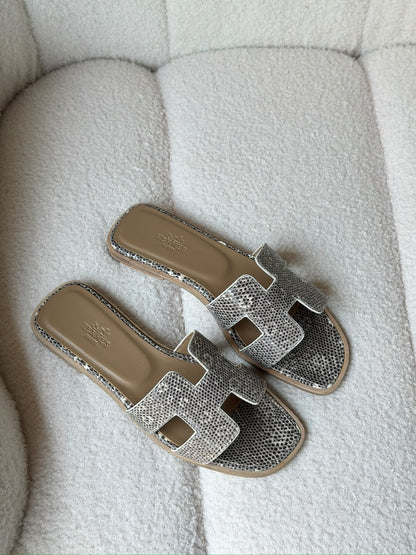 Hermès Oran sandals in crocodile-embossed leather