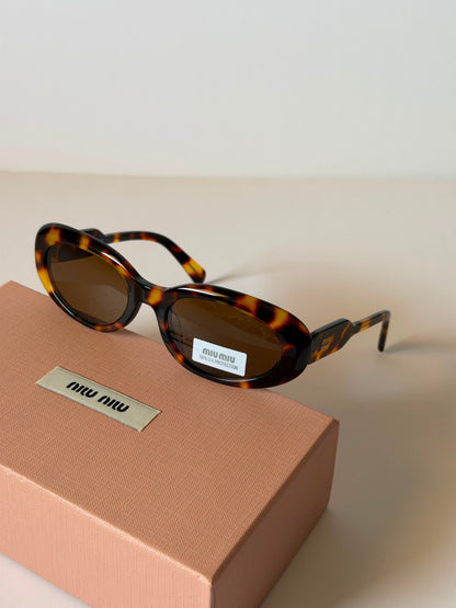 MIU MIU oval sunglasses