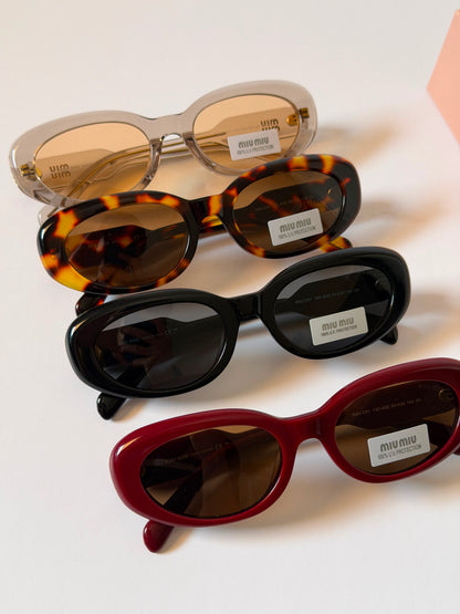 MIU MIU oval sunglasses