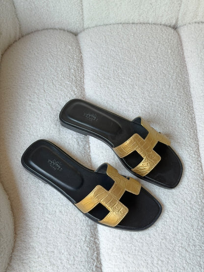 Hermès Oran sandals in crocodile-embossed leather