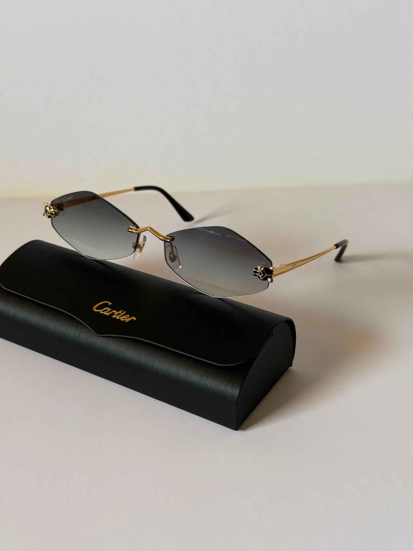 sunglasses are the Cartier Panthère de Cartier Rimless Model CT0433S