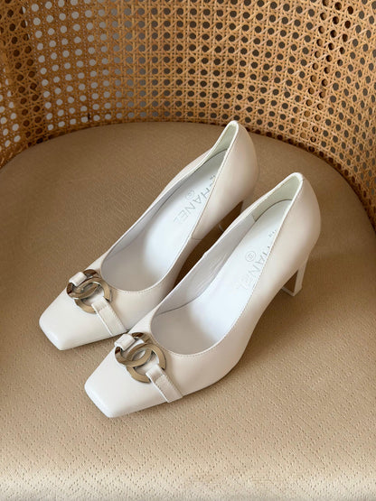 Chanel pumps featuring a chunky